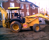 Keith on Loader/backhoe site work         photo credit:  (FAR-pic)