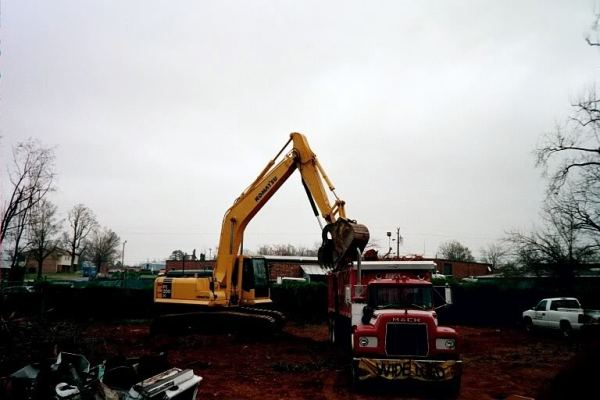 Loading Dump trailer with trackhoe       photo credit:  (FAR-pic)